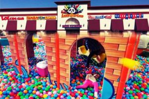 Indoor playground ball pit children playing